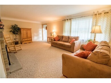 Large open living room with wood burning fireplace