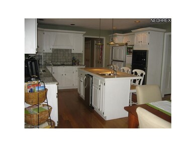 Large island provides a breakfast bar, prep sink, 