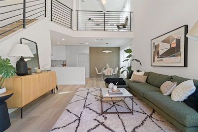 Living room featuring light wood-style flooring a