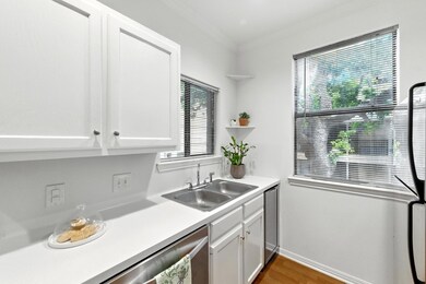 Kitchen featuring ornamental molding, wood finish