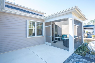 View of patio featuring a sunroom