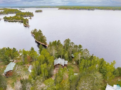 Aerial view of property's location with a nearby body of water
