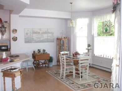 Dining Room with Bay Window and access to patio.
