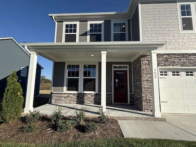 Enjoy your morning coffee or a good book on your covered front porch.
