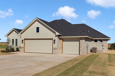 View of front facade with a front lawn, central AC