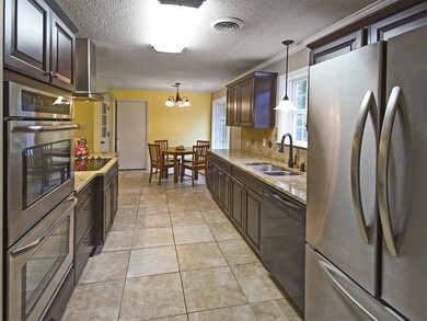 This galley kitchen has a great breakfast area and