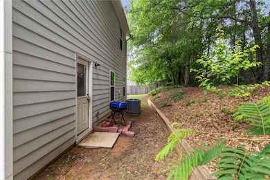 View of side of home featuring fence and central air condition unit