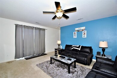 Great Room is spacious and has lighted ceiling fan