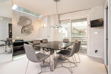 Skylight + Sliding Glass Door Frame Dining Room Beautifully