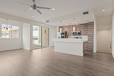 Unfurnished living room with track lighting, wood