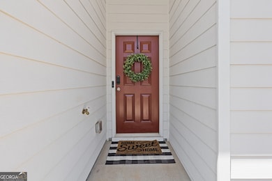 Covered front stoop areaand a warm entrance for friends and family