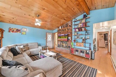Livingroom w/ Stone-Faced Fireplace