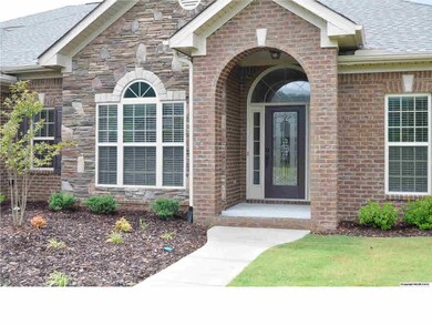 LOVELY ENTRY WAY WITH LEADED GLASS DOOR.