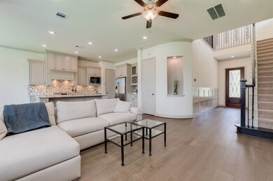 Open floor plan with spacious living area with bea