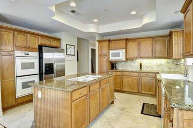 Large gourmet kitchen with big center island, lots