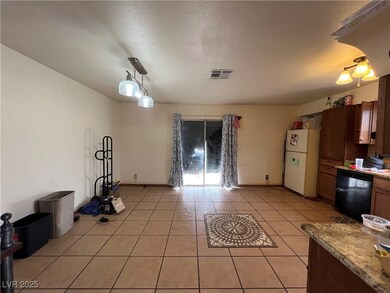 Kitchen with freestanding refrigerator, a textured