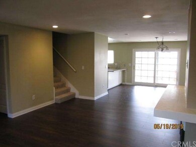 Living Room view into Dining Area, Rear Patio Door