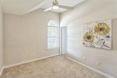 Bed 1 with walk-in closet and vaulted ceiling.