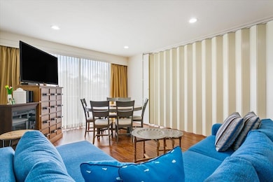 Living area with hidden retractable wall to create