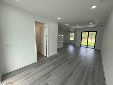 Empty room with baseboards, wood finished floors,