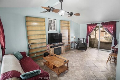 Living room with glass slider out to the backyard.