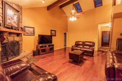 Open living, dining and kitchen with vaulted ceili