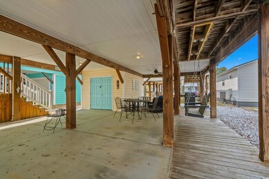 View of patio featuring stairs and outdoor dining 