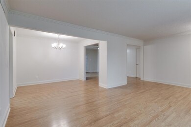 Empty room featuring baseboards, ceiling fan with 