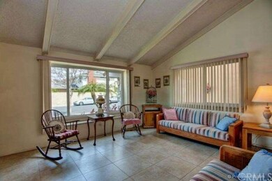 Another Angle Of The Formal Living Room, The Large Windows Allow For Plenty Of Natural Light & The Vaulted Ceilings Provide An Open And Spacious Feeling. 