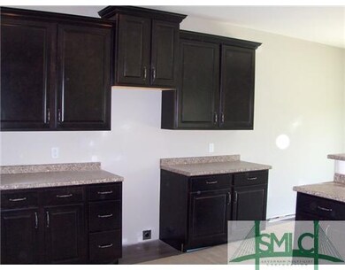 Kitchen. Kitchen has beautiful dark cabinets and c