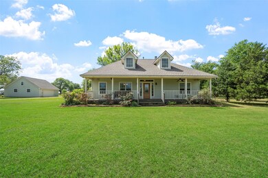 From the front, the home’s symmetrical design, dor