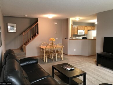 Living room, view to staircase upstairs.