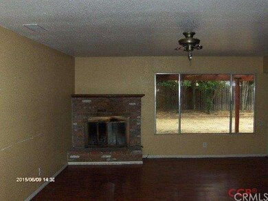 Main Home _ Living Room & Fireplace. Laminate floo