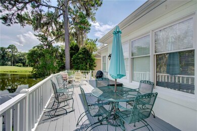 large deck overlooking lagoon and golf course.