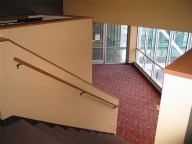Stair Going Down To Skywalk Entrance From 1st Floo