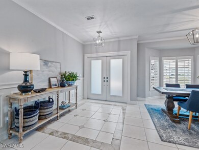 Foyer entrance featuring french doors, ornamental
