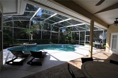 Spacious Lanai Overlooking Sparkling Pool with Tra