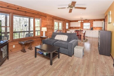 Wall of windows overlooks back covered porch
