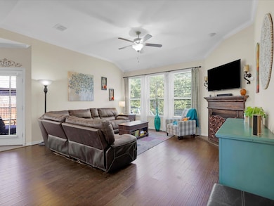 Living room with a fireplace and great view of the back yard.