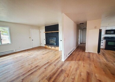 View of Living Room, Hallway, & Kitchen