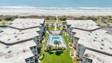 Aerial view of expansive coastline and a pool area