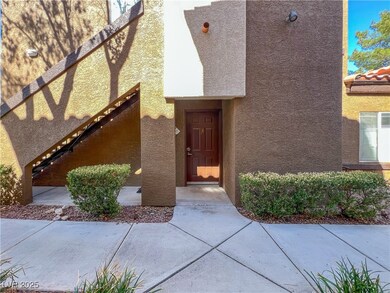 Entrance to property featuring stucco siding