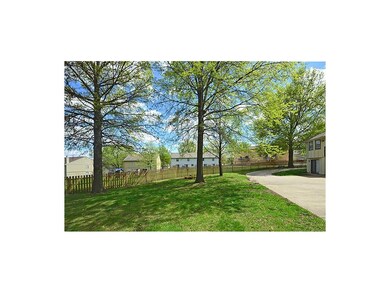 Private driveway to rear entry garages...with large yard and part of yard is fully fenced for both tenants usage,