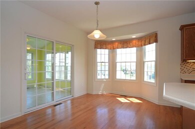 The breakfast area includes a bay window and a sli