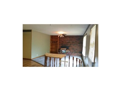 Living room shot, fire place behind books on heart