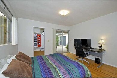 Bedroom 3 with large walk-in closet opens to backy