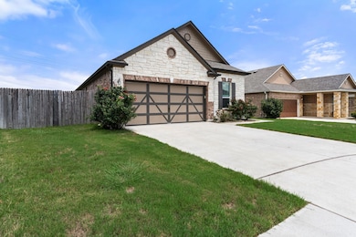 View of front of house featuring stone siding, dr