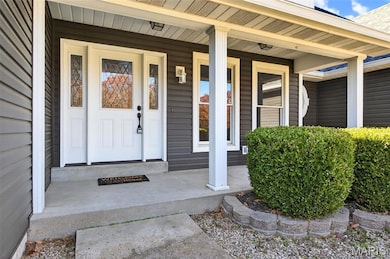 Entrance to property featuring a porch