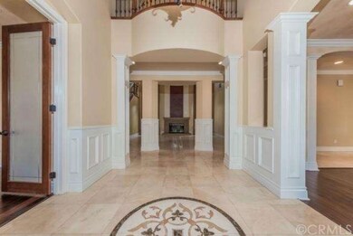 DRAMATIC FOYER leads you to an inviting FORMAL LIV