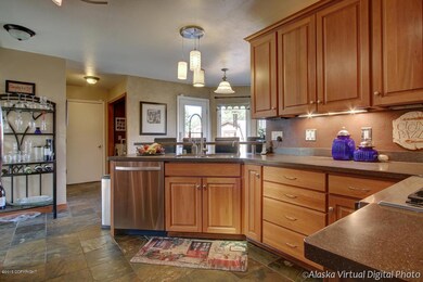 Cherry cabinets and slate tile floors